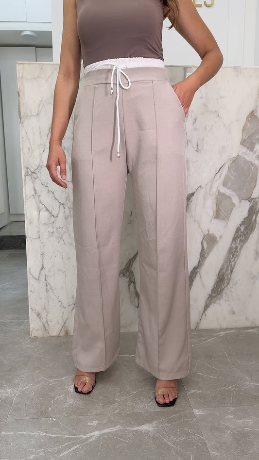 pantalon beige bande blanche