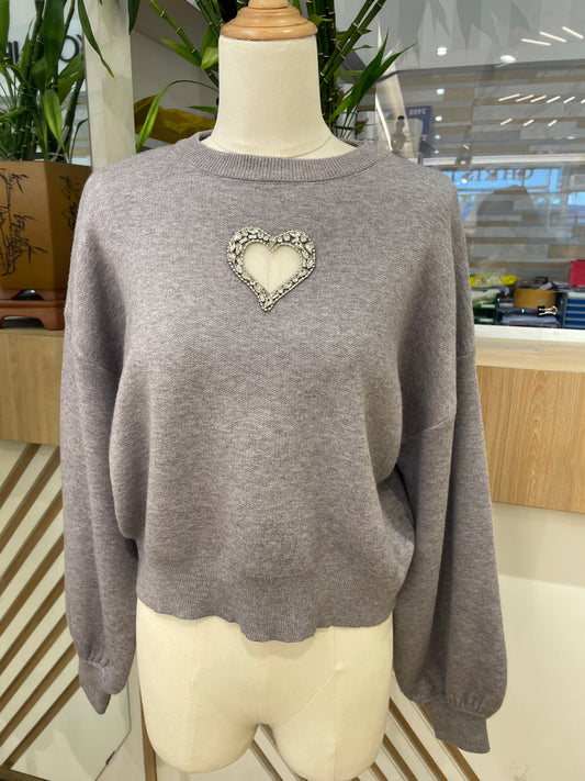 Pull trou coeur strass